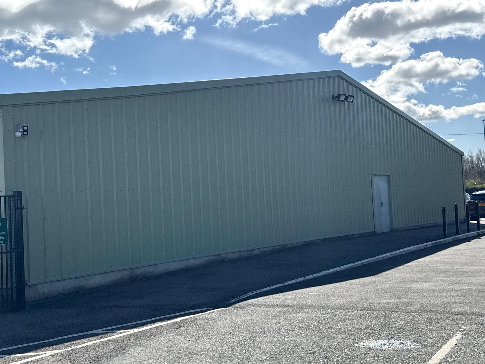 Completed green-clad industrial unit with long side elevation